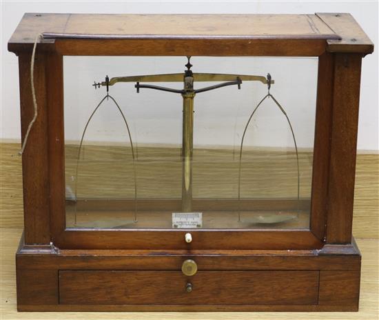A set of mahogany cased chemists scales